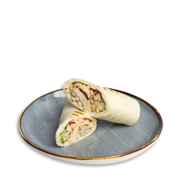 istock Delicious chicken wrap served on a stylish blue plate with white background 2190035072