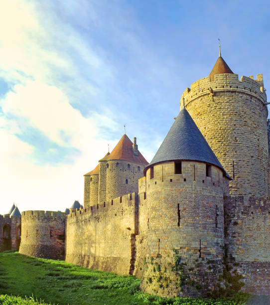 View of old castle Hotin near the river. Khotyn Fortress - medieval castle on yellow autumn hills. Ukraine, Eastern Europe. The architecture of the Middle Ages in our time.