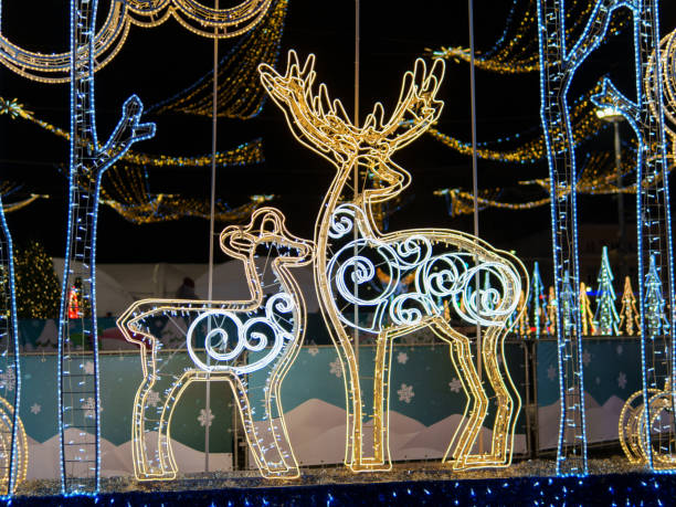 istock Festive light display featuring reindeer during holiday celebrations at night 2190038294
