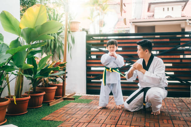 istock Children preparing for martial art with father 2190038453