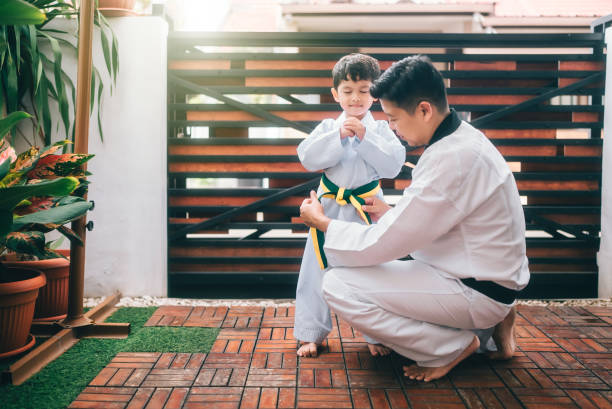 istock Children preparing for martial art with father 2190038476