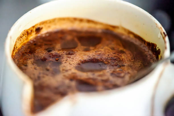 A rich, aromatic close-up of Turkish coffee in a traditional cup, showcasing its velvety foam, deep color, and cultural essence in every sip.