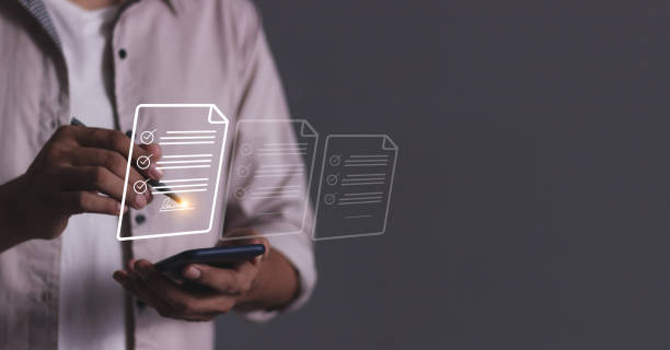 istock Young man hand holding smartphone mobile using a pen touching to sign a Contract signing, Electronic signature, Digital documents, Future smart contract, Online Business Contract 2190041697