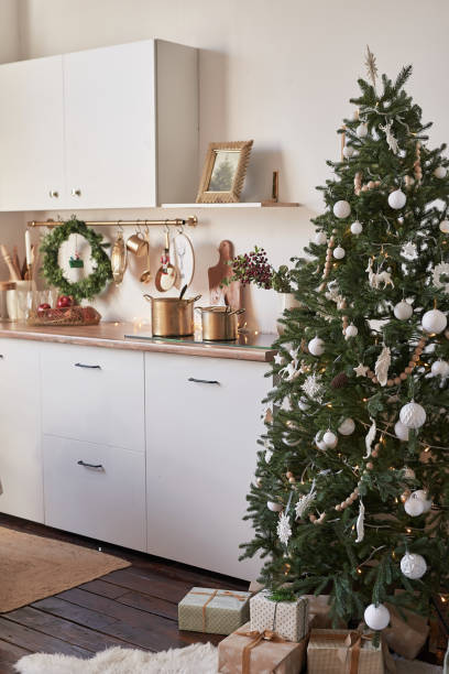 istock Christmas kitchen and table. Red, green and white decor christmas tree background. New Year celebration. Merry Christmas and Happy New Year. 2190043221