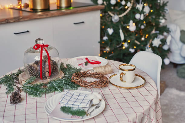 istock Christmas kitchen and table. Red, green and white decor christmas tree background. New Year celebration. Merry Christmas and Happy New Year. 2190043355