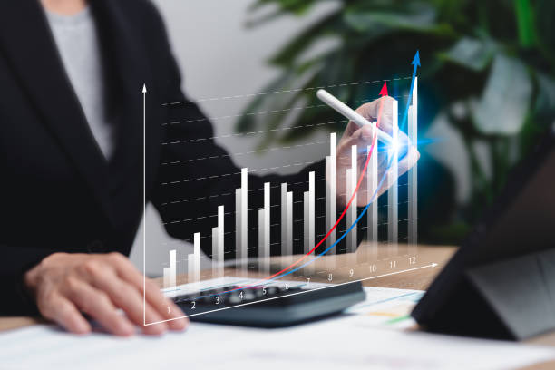 istock Business graphs statistics analyze business performance potential concepts, Businesswomen analyze charts of business target growth, Marketing performance, Profit, Financial, Next year's goal-setting 2190048558