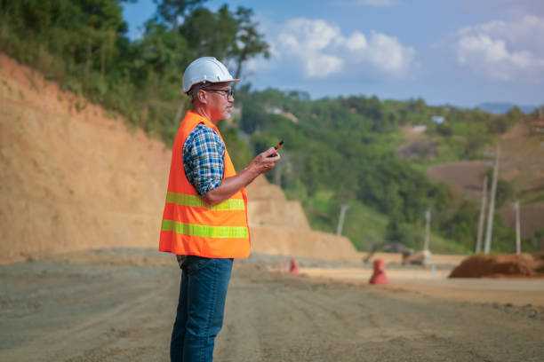istock Senior Asian engineer supervises and inspects road construction at the construction site. 2190050187