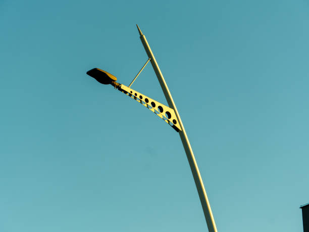 istock Unique street lamp design against clear blue sky in urban setting 2190053935