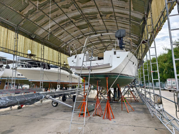 istock A boat is carefully lifted under a covered structure 2190057483