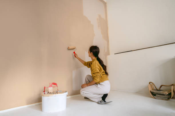 istock DIY: A woman's painting her own apartment 2190057695