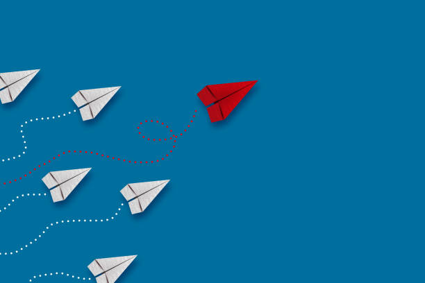 istock Leadership concept, red leader plane leading white plane, on blue background. 2190066504