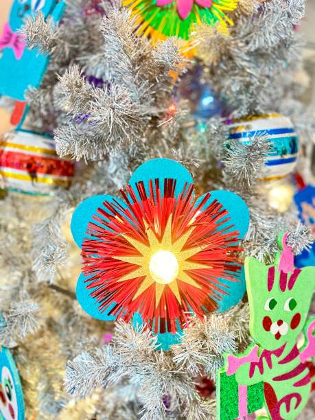 istock Vibrant Silver Christmas Tree with Colorful Ornaments and Space for Festive Greetings 2190067360