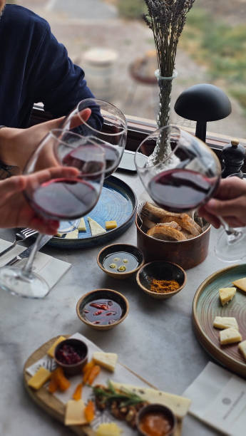 istock People tasting wine and cheese, celebration with wine glasses 2190069113