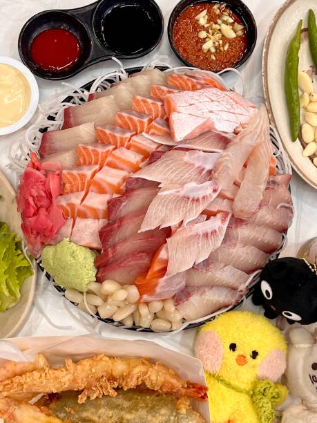 istock Sashimi, a Japanese delicacy featuring thinly sliced raw fish, served fresh and beautifully arranged for a pure and flavorful experience. 2190070236