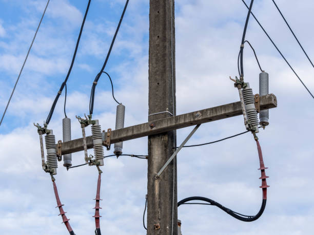 istock Electric pole with electric wires on a bright sky background. 2190072411
