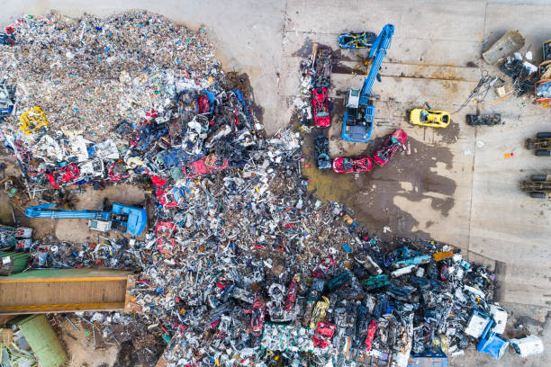 istock Large-scale waste site with numerous discarded materials and machinery operating on a recycling project 2190074580