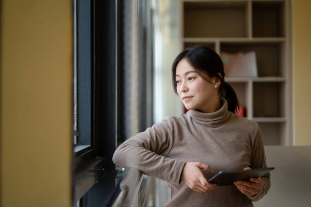 istock asian businesswoman using digital tablet in office 2190076864