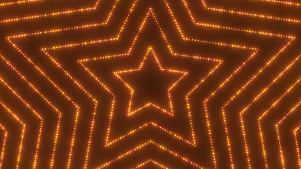 istock Bright Gold Flashing Sparkle Lights Arranged In Expanding Star Shapes - Abstract Background Texture 2190076898