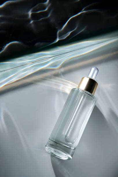 istock Bottle of face serum with a pipette with a beautiful highlight. 2190077292