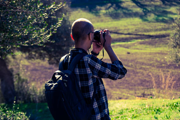 istock A man is hiking in the mountain, photographing nature 2190077405
