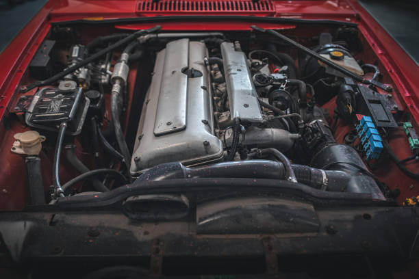 istock Inline six engine of a classic, luxury car exposed as bonnet is removed. 2190080210