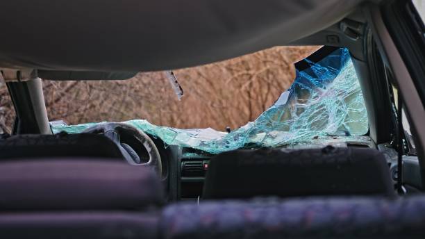istock Damaged Car with Shattered Windshield from Road Accident Scene 2190084613