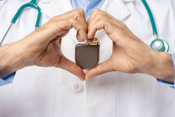 istock Professional doctor holding pacemaker, selective focus on hands, closeup. Cardiology concept 2190085103