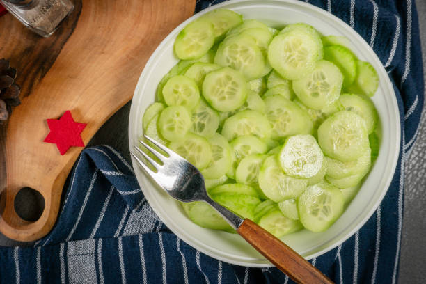 Fresh green cucumber cut into slices.
