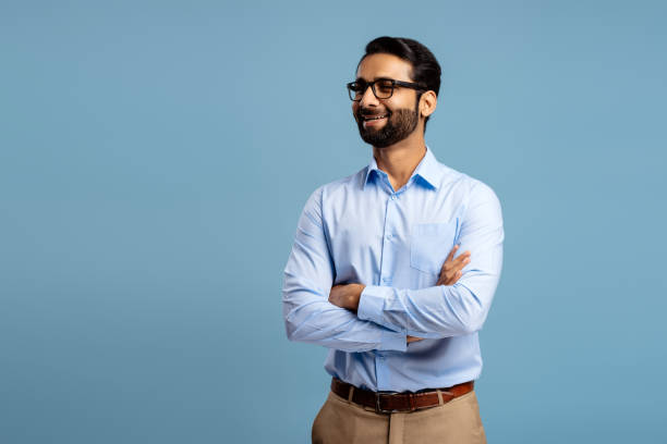 istock Smiling, Indian man wearing stylish eyeglasses, looking away on copy space. Successful businessman 2190087293