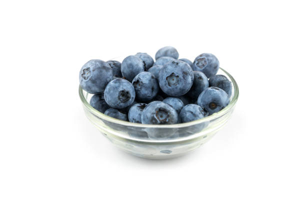 istock blueberries in a glass bowl on a white background. 2190091017