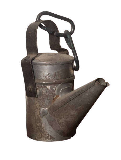 istock ancient  miner's lamp  oil lamp on white isolated 2190093509
