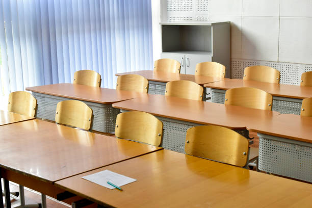 istock Empty desks and chairs at school. School holidays. 2190093704