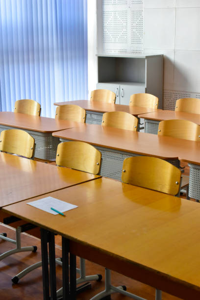 istock Empty desks and chairs at school. School holidays. 2190093709
