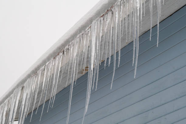 istock Beautiful icicles cascading from a roof and providing a view 2190096248