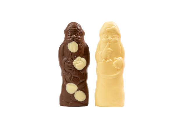 istock Two chocolate figures, one of which is a santa, are sitting next to each other 2190097108