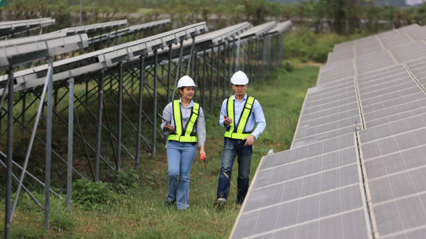 istock Two solar engineers are inspecting the solar farm site thoroughly. They focus on implementing zero-carbon credit strategies and promoting green energy initiatives. Their expertise and dedication are crucial in advancing sustainable energy solutions. 2190100408