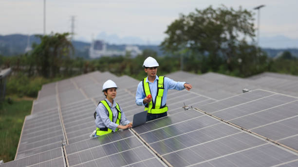 istock Two solar engineers are inspecting the solar farm site thoroughly. They focus on implementing zero-carbon credit strategies and promoting green energy initiatives. Their expertise and dedication are crucial in advancing sustainable energy solutions. 2190100412