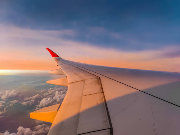 istock The view from the airplane window to the clouds and sunset during a flight 2190103349