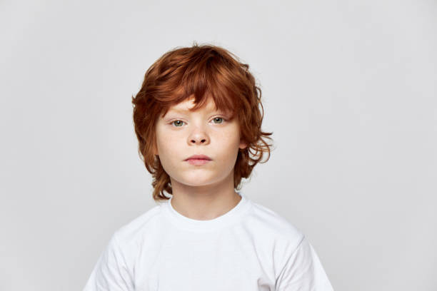 istock ginger child t-shirt cropped view gray background 2190104204