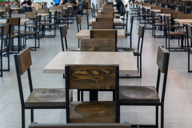 istock Empty wooden table in food court 2190106544