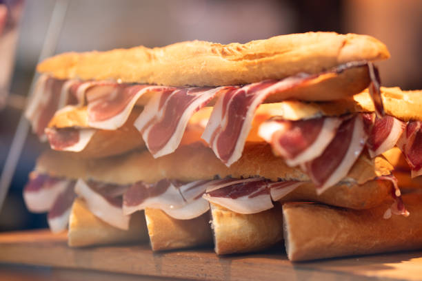 istock Close-up of a ciabatta sandwich filled with Jamon. 2190110363