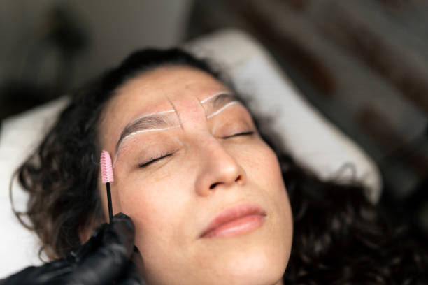 istock Beautician preparing eyebrows for waxing treatment 2190113265