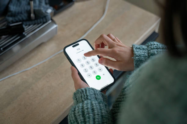 istock Woman dialing emergency number 112 on smartphone 2190114463