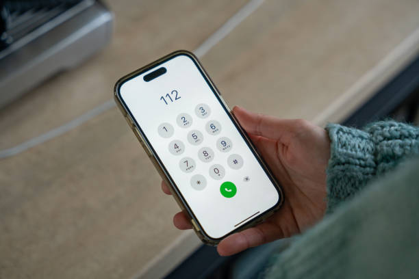 istock Woman calling emergency number 112 on smartphone 2190114475