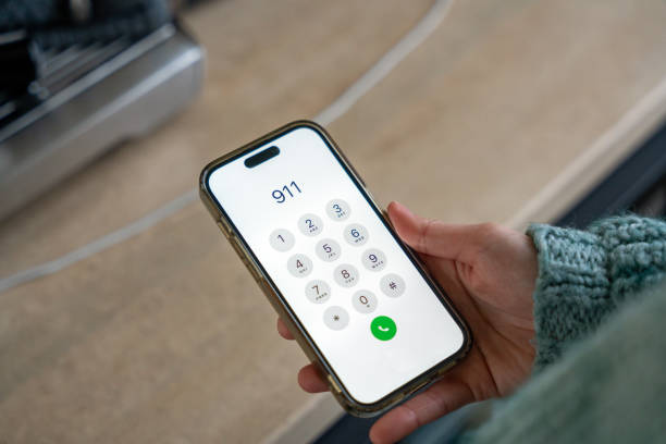 istock Woman calling 911 emergency number on smartphone 2190114501