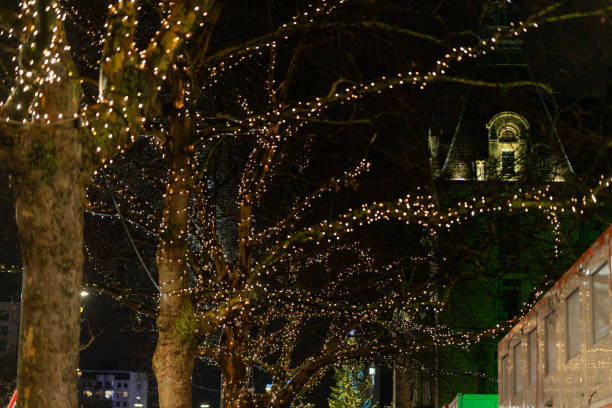 Christmas lights create a magical atmosphere in a city center at night