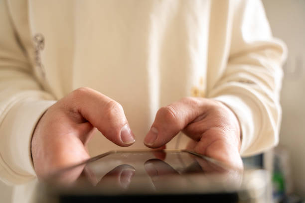 istock Close-up of hands typing on smartphone screen 2190115230