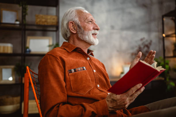 istock senior man enjoy in the living room while read a book 2190115232