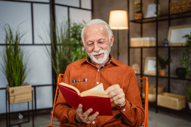 istock senior man enjoy in the living room while read a book 2190115376