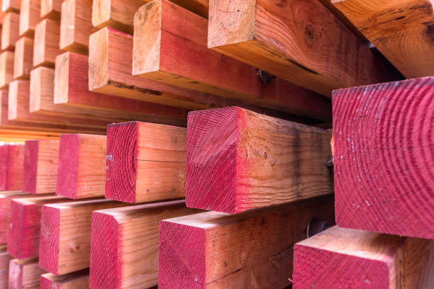 Background of a stack of new wood ready to be used in construction.
